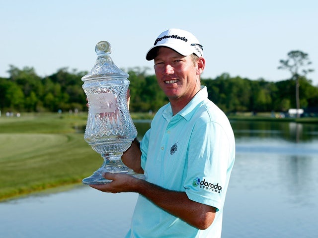 Jim Herman of the United States poses with the trophy after his victory at the Shell Houston Open at the Golf Club of Houston on April 3, 2016