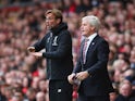 Jurgen Klopp and Mark Hughes on the touchline during the Premier League game between Liverpool and Stoke City on April 10, 2016