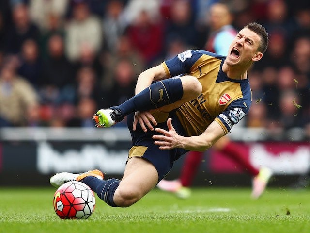 Laurent Koscielny injures his dick during the Premier League game between West Ham United and Arsenal on April 9, 2016