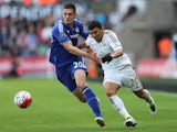 Matt Miazga gives Jefferson Montero a tug during the Premier League game between Swansea City and Chelsea on April 9, 2016