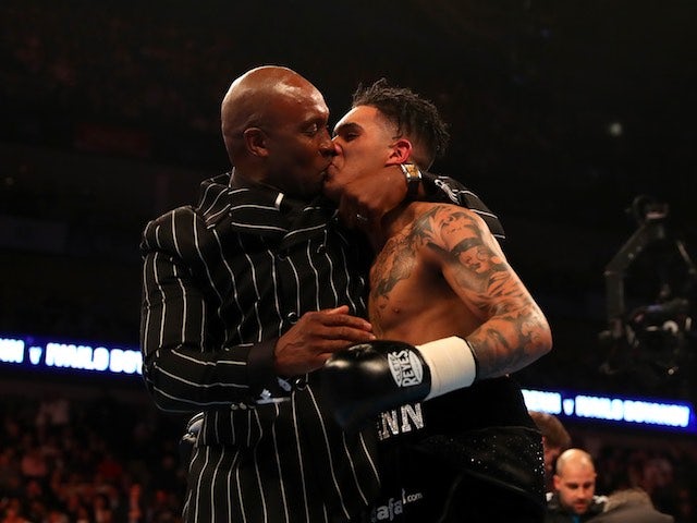 Nigel Benn gets off with his son Conor Benn at The O2 on April 9, 2016