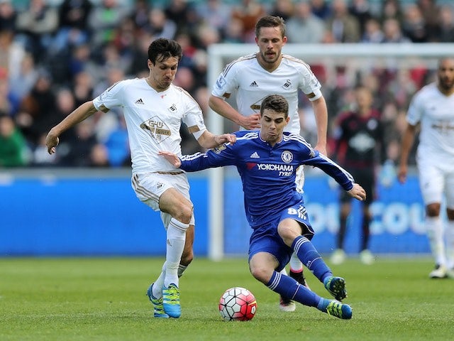 Oscar holds off Jack Cork during the Premier League game between Swansea City and Chelsea on April 9, 2016
