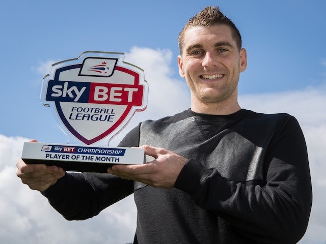 Sam Vokes poses with his Championship player of the month award for March 2016