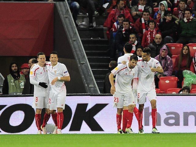 Sevilla players celebrate their second during the Europa League quarter-final between Athletic Bilbao and Sevilla on April 7, 2016