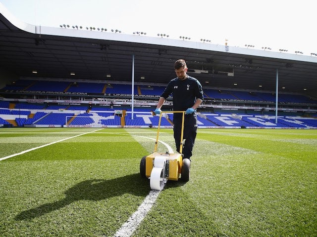 A Sexy Groundsman prepares the pitch prior to the Premier League game between Tottenham Hotspur and Manchester United on April 10, 2016