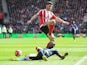 Shane Long and Chancel Mbemba during the Premier League match between Southampton and Newcastle United on April 9, 2016