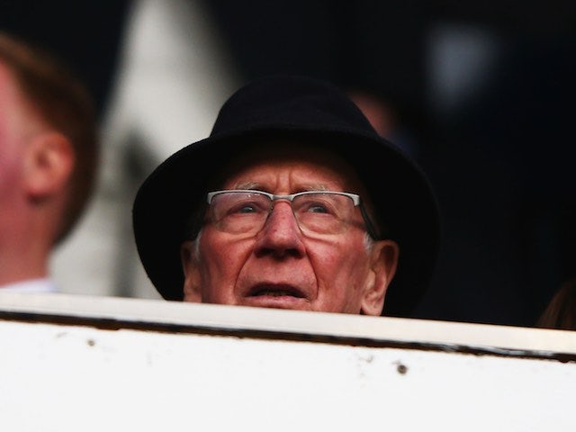 Sir Bobby Charlton plays peek-a-boo during the Premier League game between Tottenham Hotspur and Manchester United on April 10, 2016