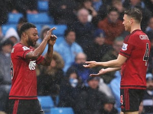 Stephane Sessegnon celebrates with James Chester during the Premier League game between Manchester City and West Bromwich Albion on April 9, 2016