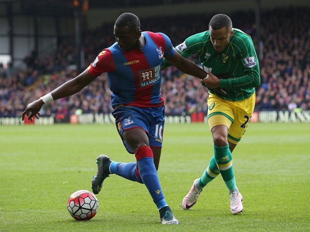 Yannick Bolasie and Martin Olsson in action during the Premier League match between Crystal Palace and Norwich City on April 9, 2016