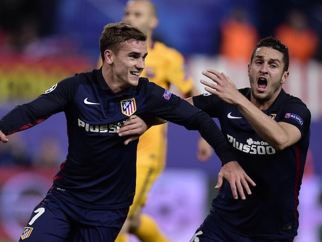 Antoine Griezmann celebrates after putting Atletico Madrid 2-0 in front against Barcelona in their Champions League quarter-final second leg on April 13, 2016