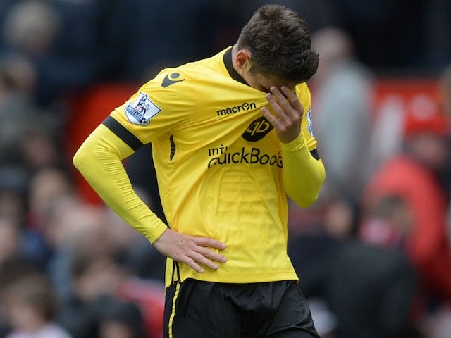 Ashley Westwood wipes away tears after the Premier League game between Manchester United and Aston Villa on April 16, 2016
