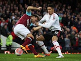 Chris Smalling and Mark Noble in action during the FA Cup replay between West Ham United and Manchester United on April 13, 2016