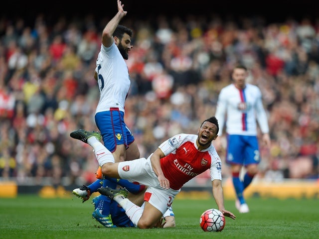 Francis Coquelin is tackled by Yohan Cabaye during the Premier League game between Arsenal and Crystal Palace on April 17, 2016