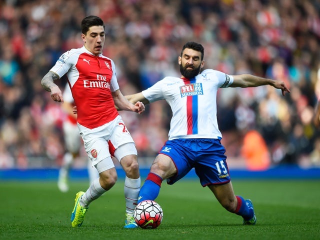 Hector Bellerin is tackled by Mile Jedinak during the Premier League game between Arsenal and Crystal Palace on April 17, 2016
