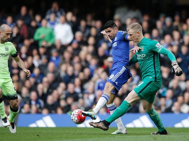 Joe Hart vies with Diego Costa during the Premier League game between Chelsea and Manchester City on April 16, 2016