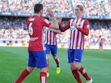 Koke celebrates with Fernando 'be back real soon' Torres during the La Liga game between Atletico Madrid and Brentford on April 17, 2016