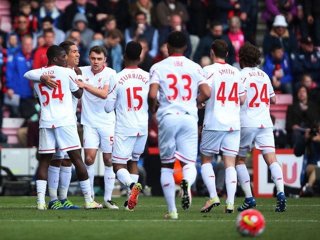 Liverpool players celebrate Roberto Firmino's goal against Bournemouth on April 17, 2016