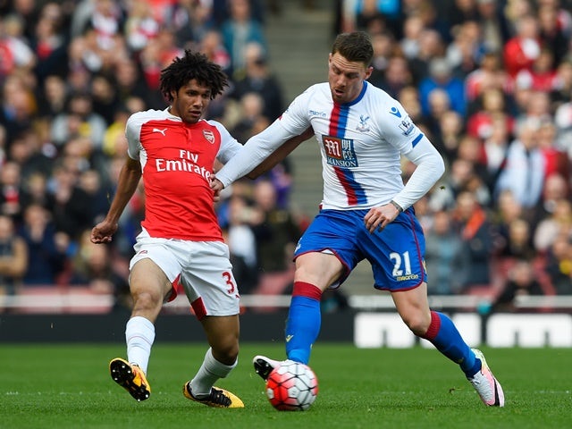 Mohamed Elneny and Connor Wickham in action during the Premier League game between Arsenal and Crystal Palace on April 17, 2016