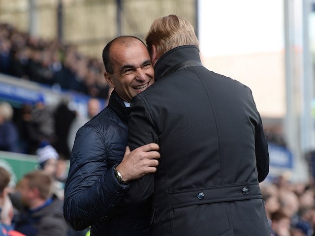 Roberto Martinez embraces Ronald Koeman prior to the Premier League game between Everton and Southampton on April 16, 2016