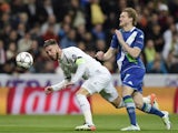 Sergio Ramos attempts to fend off Andre Schurrle during the Champions League quarter-final between Real Madrid and Wolfsburg on April 12, 2016