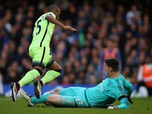 Thibaut 'hi kev!' Courtois brings down Fernandinho during the Premier League game between Chelsea and Manchester City on April 16, 2016