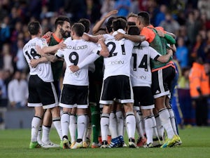 Valencia players celebrate taking the lead during the La Liga game between Barcelona and Valencia on April 17, 2016