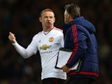 Wayne 'have you got change for a twenty?' Rooney has a chat with Louis van Gaal during the FA Cup replay between West Ham United and Manchester United on April 13, 2016