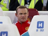 Wayne Rooney watches from the bench during the FA Cup replay between West Ham United and Manchester United on April 13, 2016