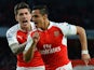 Alexis Sanchez celebrates with Hector Bellerin after scoring the opening goal during the Premier League match between Arsenal and West Bromwich Albion on April 21, 2016