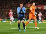 Dele Alli reacts after hitting the woodwork during the Premier League game between Stoke City and Tottenham Hotspur on April 18, 2016