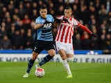Erik Lamela and Ibrahim Afellay in action during the Premier League game between Stoke City and Tottenham Hotspur on April 18, 2016