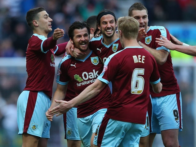 Joey Barton celebrates with teammates as his deflected free kick goes in for the opening goal during the Championship match between Preston North End and Burnley at Deepdale on April 22, 2016