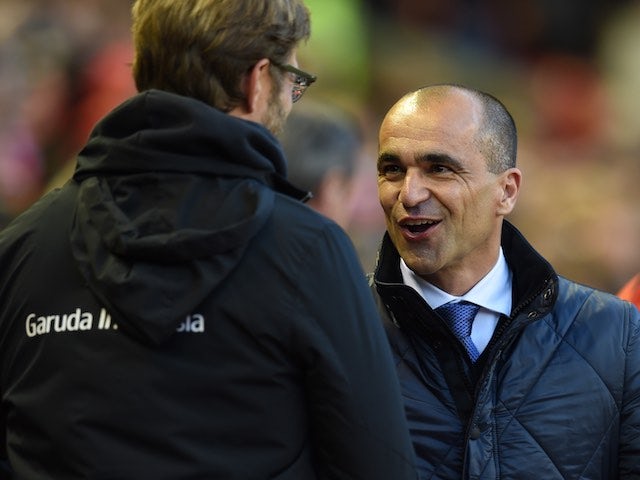Jurgen Klopp and Roberto Martinez greet each other prior to the Premier League game between Liverpool and Everton on April 20, 2016