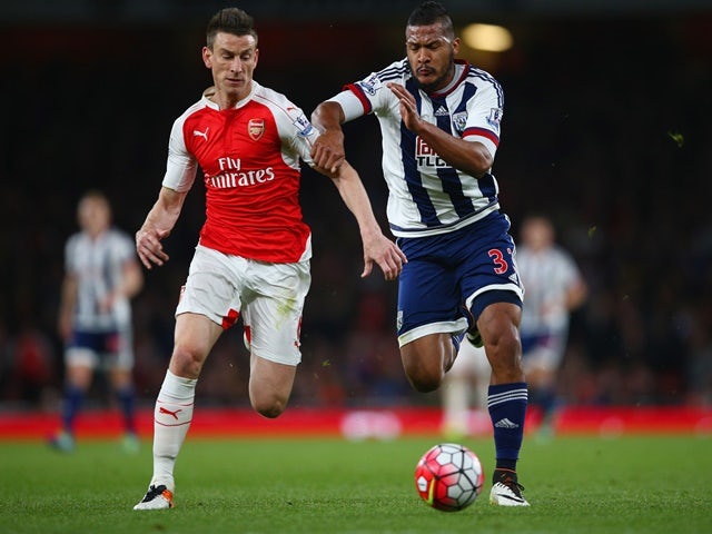 Laurent Koscielny and Salomon Rondon battle for the ball during the Premier League match between Arsenal and West Bromwich Albion at the Emirates Stadium on April 21, 2016