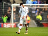 Nicky Maynard wipes his eyes as MK Dons' relegation from the Championship is confirmed on April 23, 2016