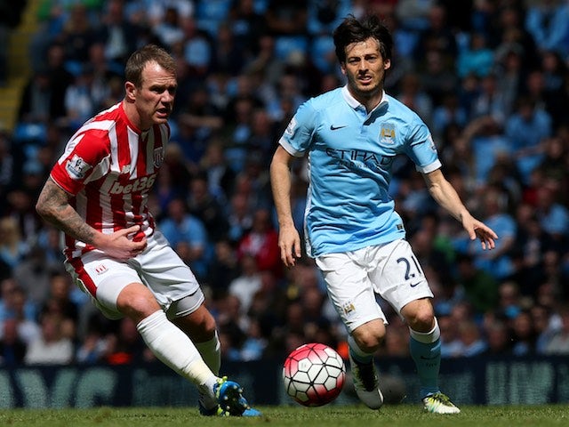 Phil Bardsley and David Silva in action during the Premier League game between Manchester City and Stoke City on April 23, 2016