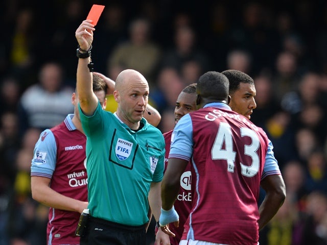 Aly Cissokho is shown the red card by Anthony Taylor during the Premier League match between Watford and Aston Villa on April 30, 2016