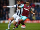 Dimitri Payet and Sandro in action during the Premier League match between West Bromwich Albion and West Ham United on April 30, 2016