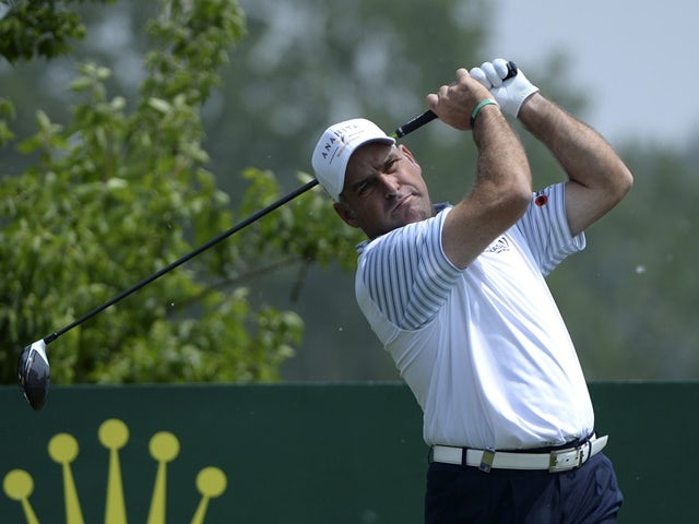 Hennie Otto of South Africa plays a shot during the first round of the Volvo China Open golf tournament in Beijing on April 28, 2016
