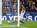 Leonardo Ulloa beats Federico Fernandez of Swansea City to score his team's third goal during the Premier League match between Leicester City and Swansea City on April 24, 2016