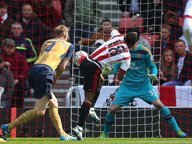 Jermain Defoe of Sunderland's shot comes off the shoulder of Per Mertesacker of Arsenal on April 24, 2016