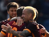 Radja Nainggolan celebrates with teammates after scoring in the Serie A match between Roma and Napoli on April 25, 2016