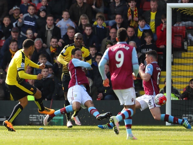 Troy Deeney scores his side's third goal during the Premier League match between Watford and Aston Villa on April 30, 2016