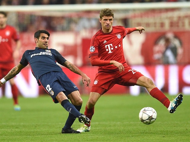 Augusto Fernandez and Thomas Muller during the Champions League semi-final second leg between Bayern Munich and Atletico Madrid on May 3, 2016