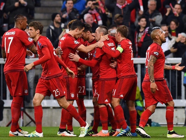 Bayern Munich players celebrate Xabi Alonso's opening goal in the Champions League semi-final against Atletico Madrid on May 3, 2016