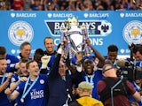 Claudio Ranieri and his Leicester City players celebrate with the Premier League trophy on May 7, 2016