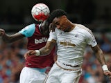 Leroy Fer and Cheikhou Kouyate vie in the air during the Premier League match between West Ham United and Swansea City on May 7, 2016