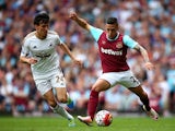 Manuel Lanzini and Jack Cork in action during the Premier League match between West Ham United and Swansea City on May 7, 2016