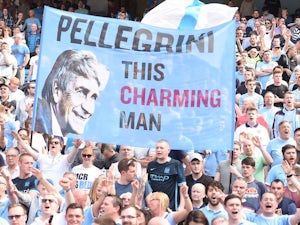 Manchester City fans hold up a sign for Manuel Pellegrini on May 8, 2016