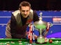 Mark Selby poses with the trophy after beating Ding Junhui in the final of the World Snooker Championship at the Crucible on May 2, 2016